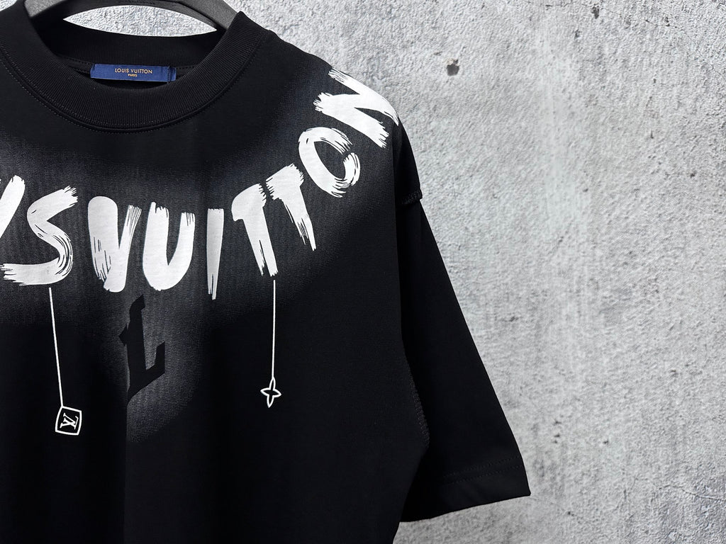 Close-up black short-sleeve T-shirt with large white graffiti lettering