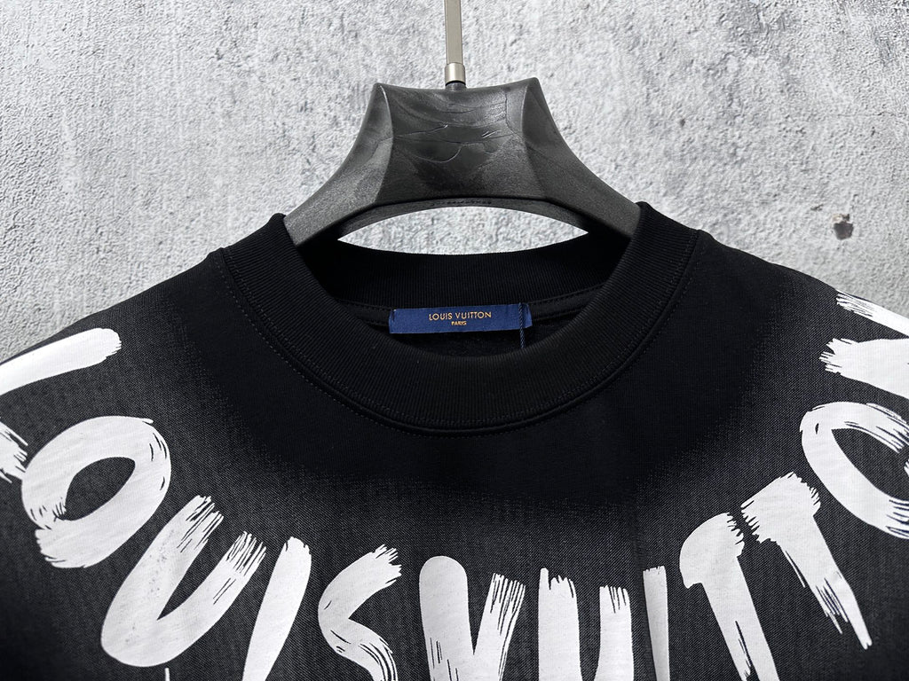 Close-up short-sleeve black T-shirt neckline with white graffiti print