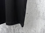 Black short-sleeve T-shirt hem with stitched side seam