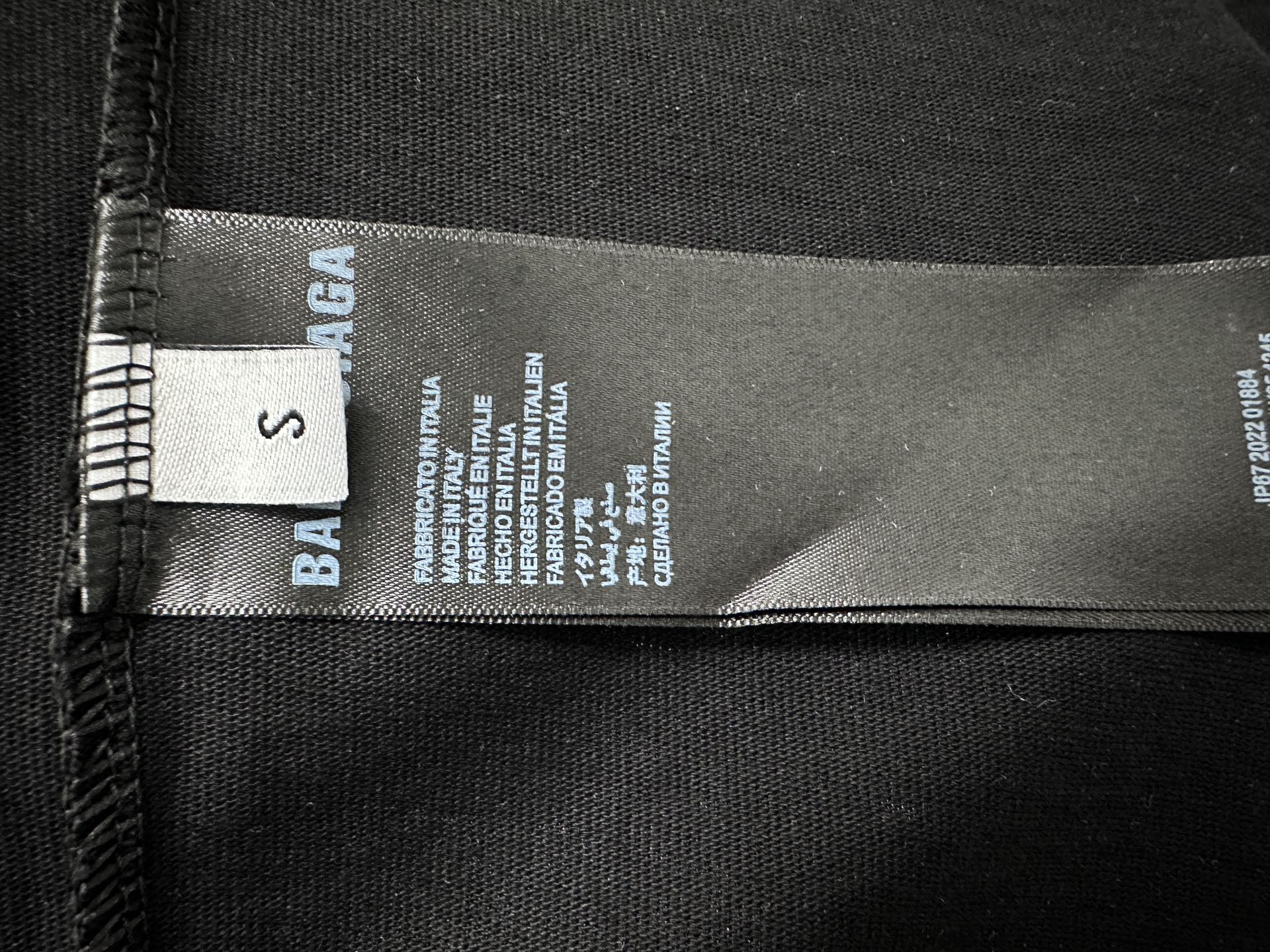 Balenciaga size and care label on black T-shirt hem