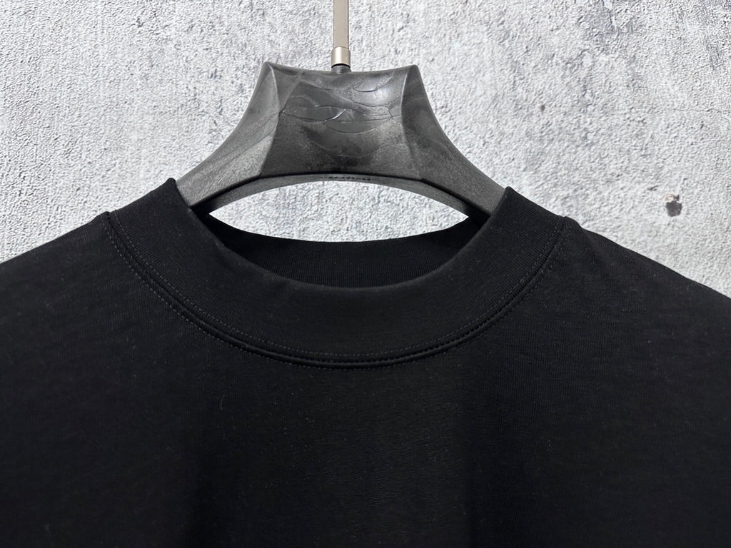 Balenciaga black crew neck T-shirt, close-up of neckline and upper chest