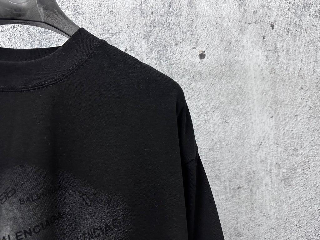 Balenciaga black short-sleeve T-shirt, close-up of shoulder and crew neckline