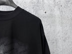 Balenciaga black short-sleeve T-shirt, close-up of shoulder and crew neckline