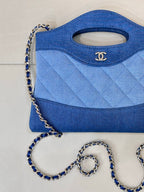 Chanel blue quilted bag with side seam details and silver-tone chain shoulder strap