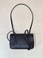 Chanel handbag front view with flap, dark blue leather, and two top handles.