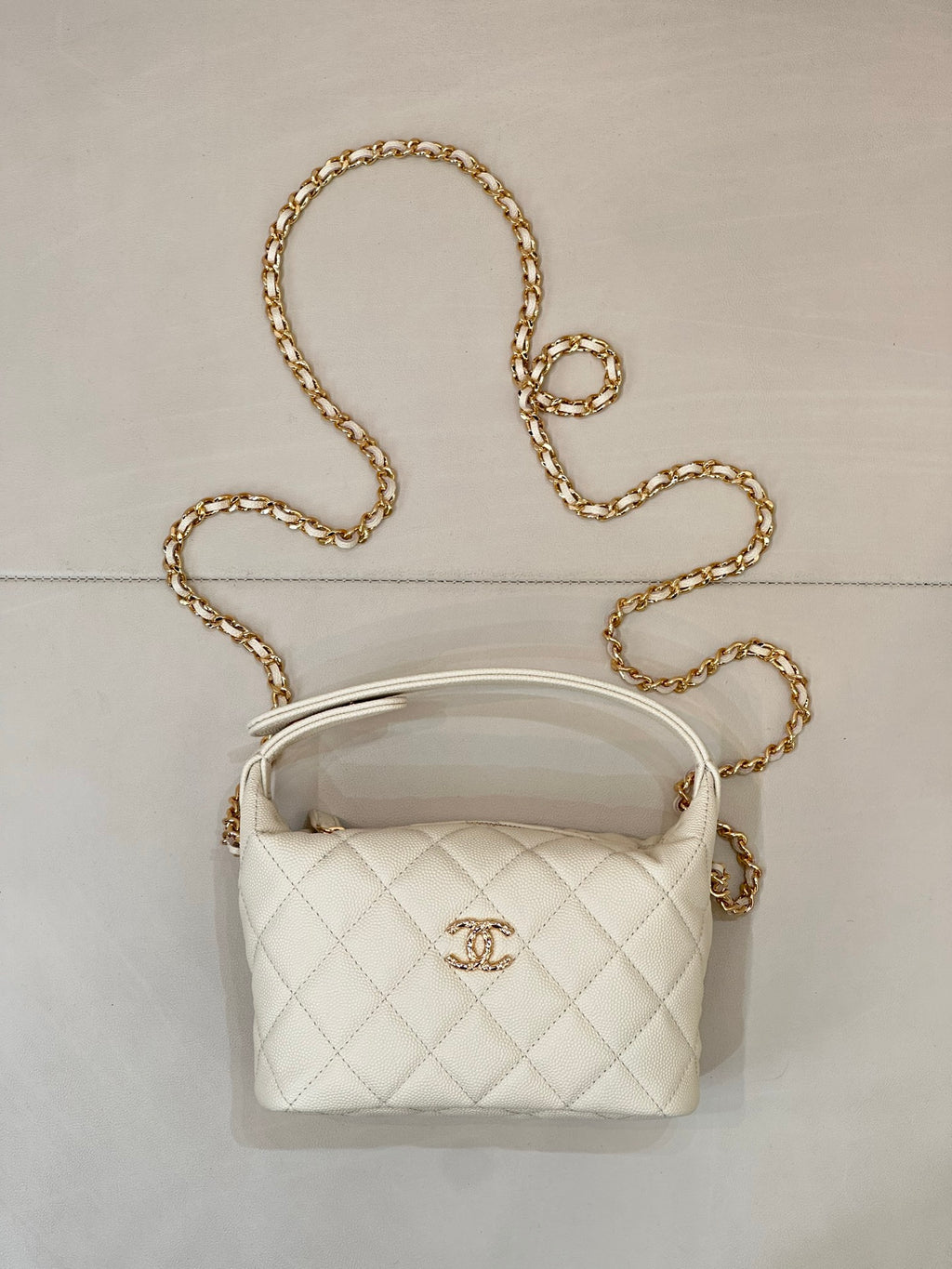 Chanel quilted mini bag, white, with gold chain strap and top handle