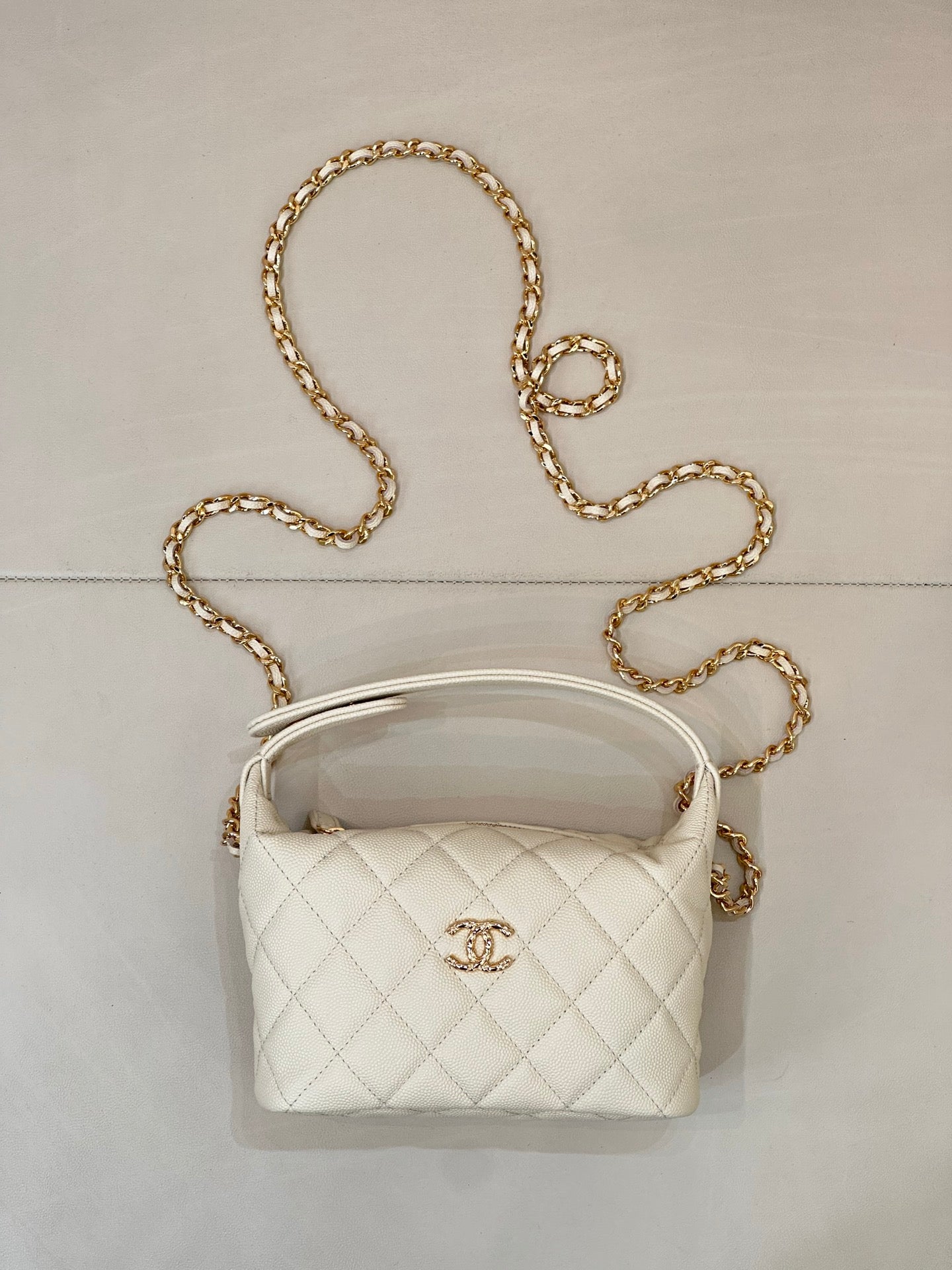 Chanel quilted mini bag, white, with gold chain strap and top handle