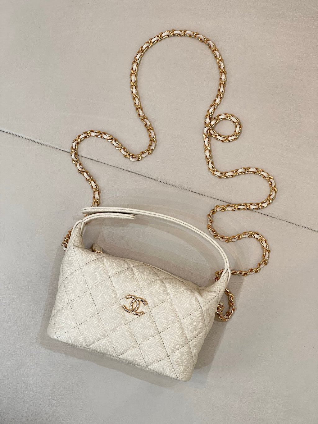 Chanel quilted mini bag, white, with gold chain strap and logo front