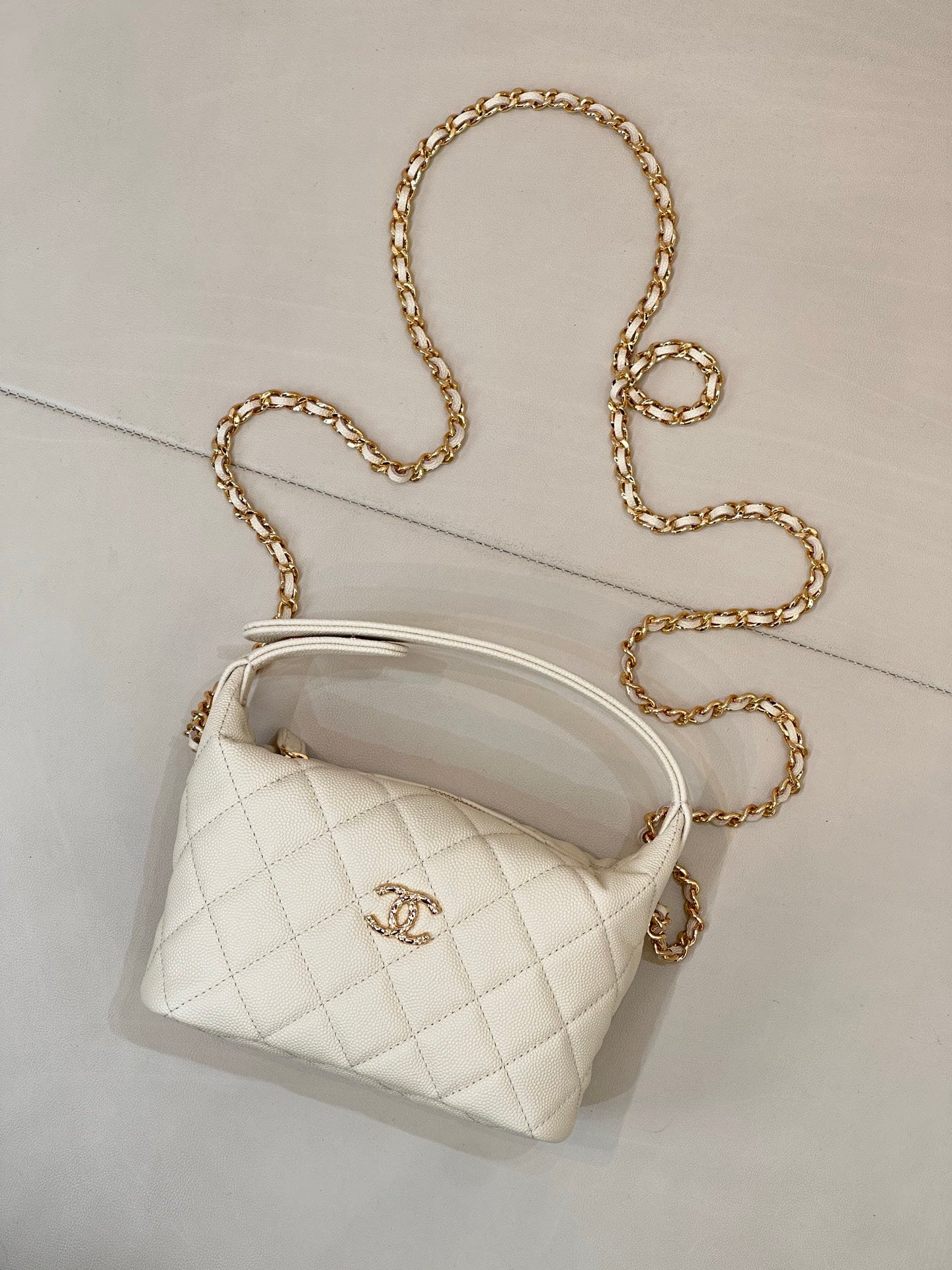Chanel quilted mini bag, white, with gold chain strap and logo front