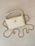 Chanel quilted mini bag, white, with gold chain strap and front logo
