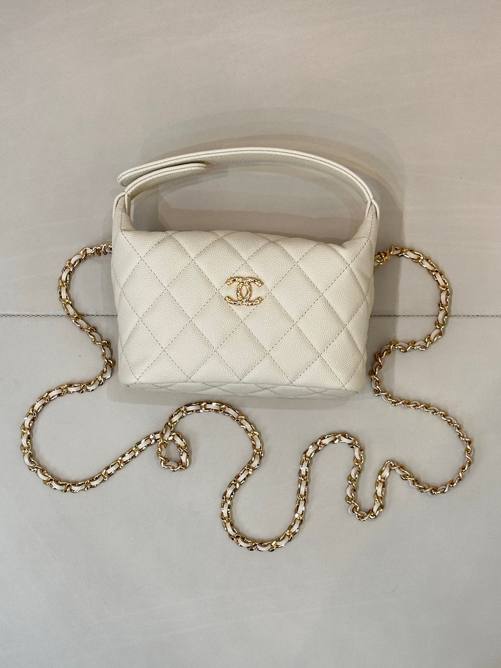 Chanel quilted mini bag, white, with gold chain strap and open top