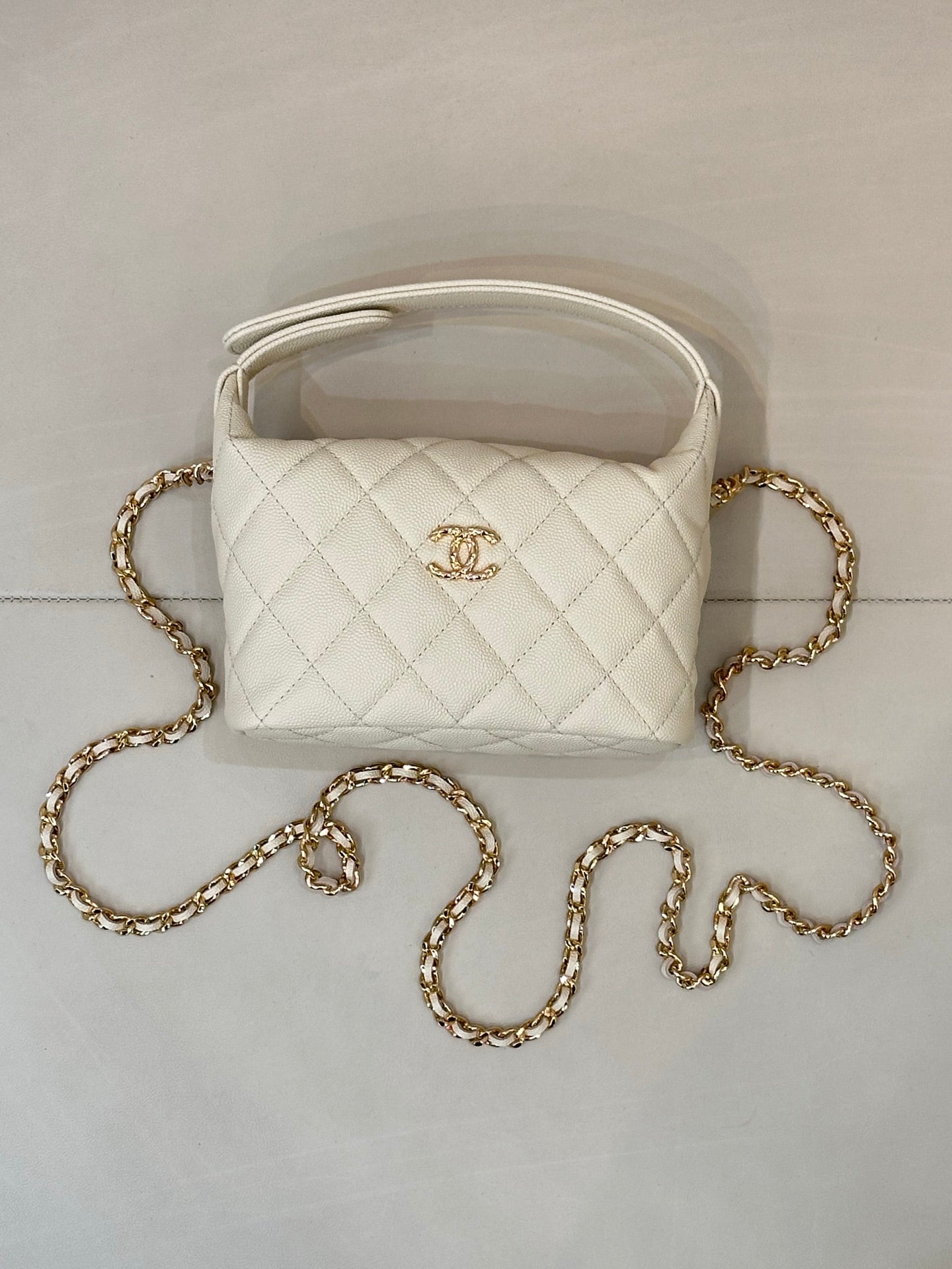 Chanel quilted mini bag, white, with gold chain strap and open top