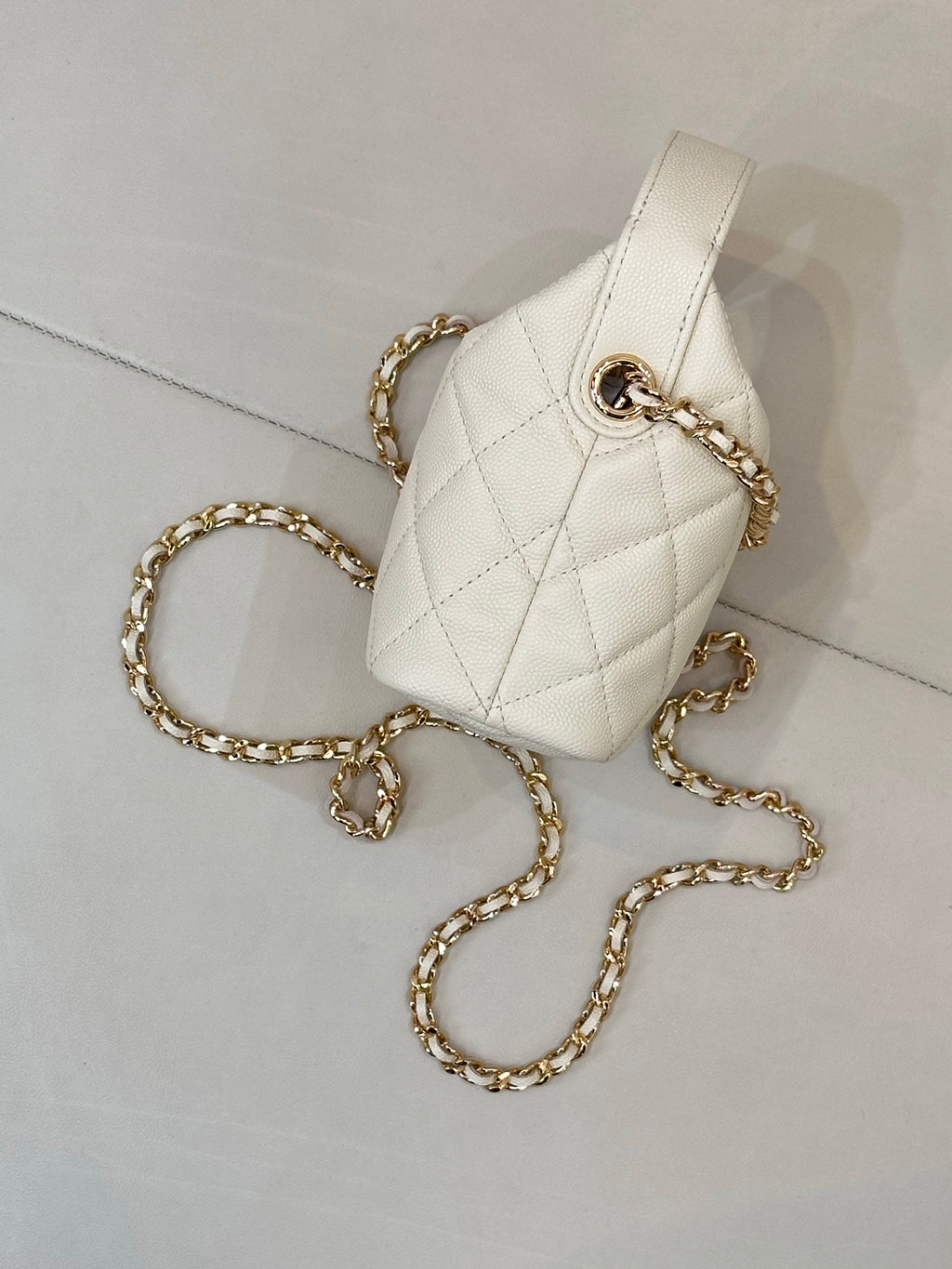 Chanel quilted mini bag, white, with gold chain strap and top handle ring