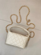 Chanel quilted mini bag, white, with gold chain strap and domed top handle