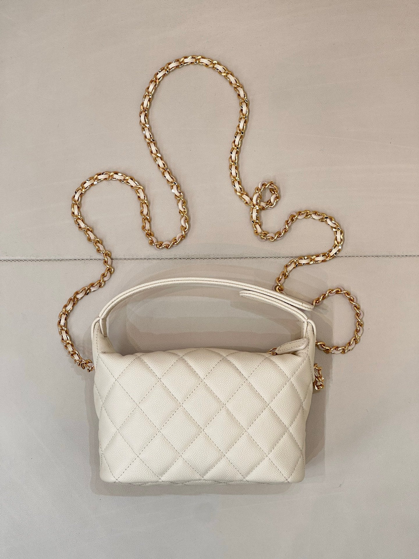 Chanel quilted mini bag, white, with gold chain strap and quilted front