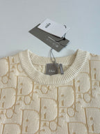 Cream jacquard knit sweater neckline with Dior label and ribbed crew collar