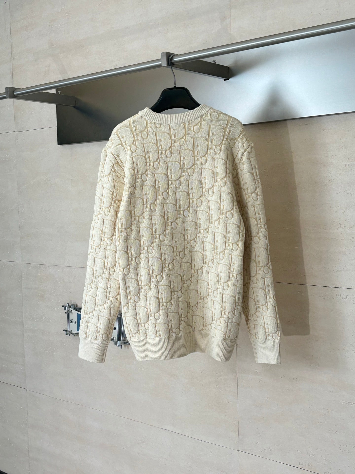 Cream jacquard knit sweater, back view, long sleeves with ribbed cuffs and hem