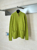 Green knit zip-up sweater with textured cable pattern and ribbed cuffs