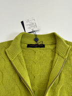 Green knit sweater with half-zip neckline and Louis Vuitton neck label