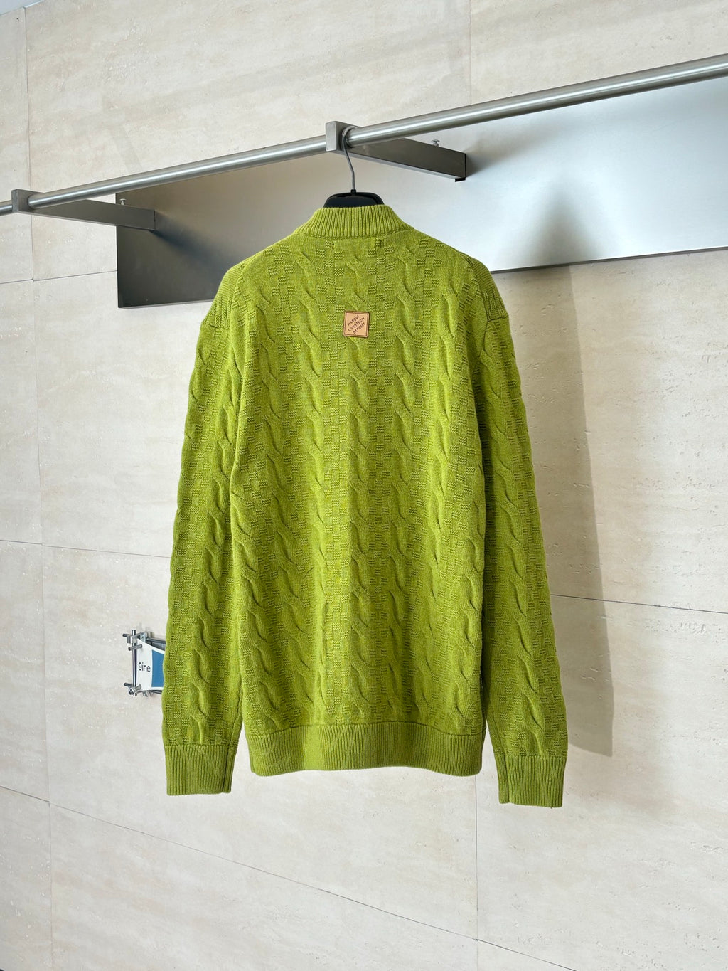 Lime green knit zip cardigan, back view with small logo patch