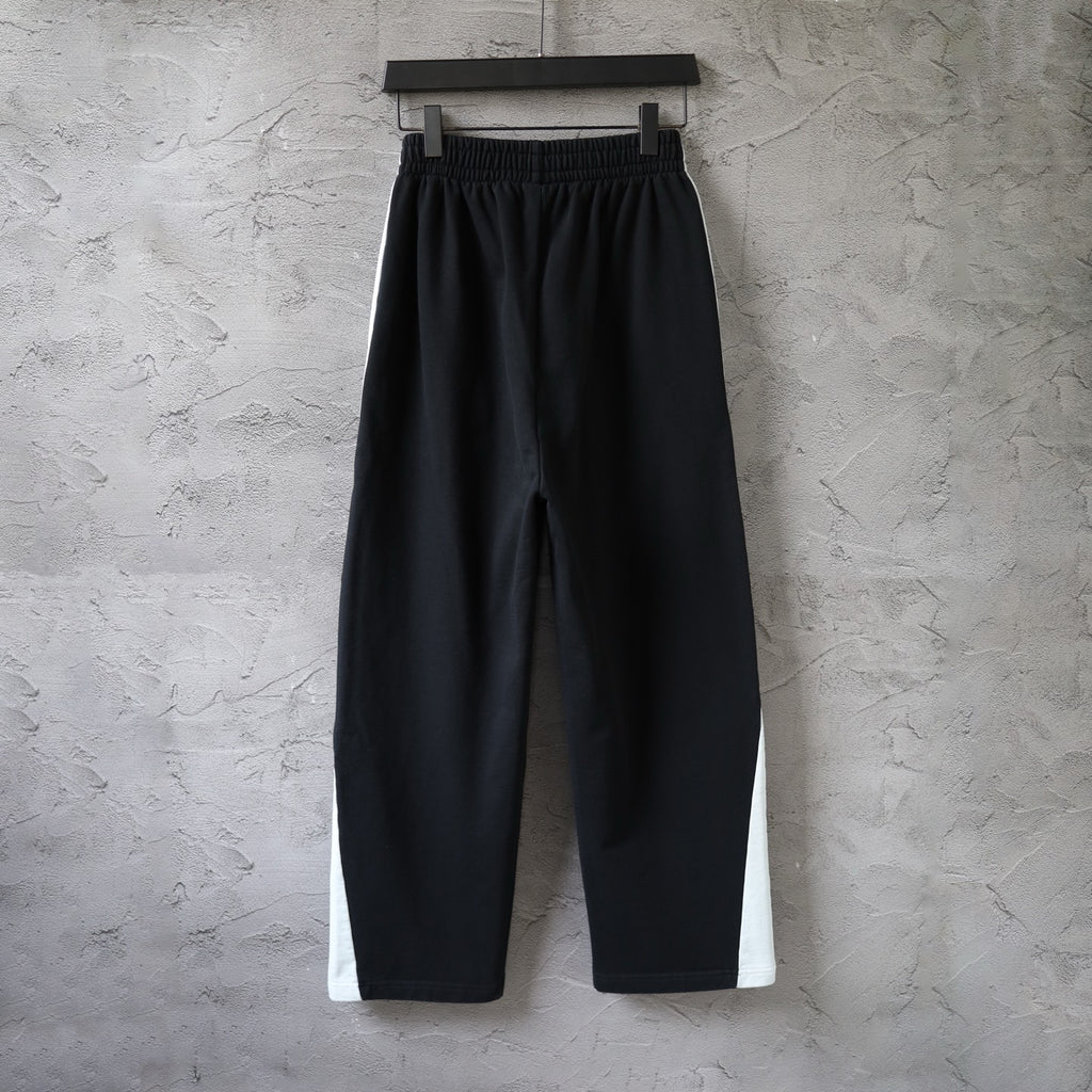 Black Balenciaga pants with elastic waistband and relaxed wide-leg silhouette
