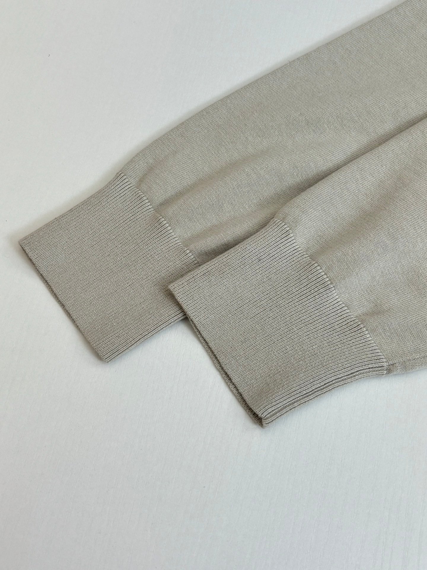 Light cream knit cardigan hem and ribbed cuff detail