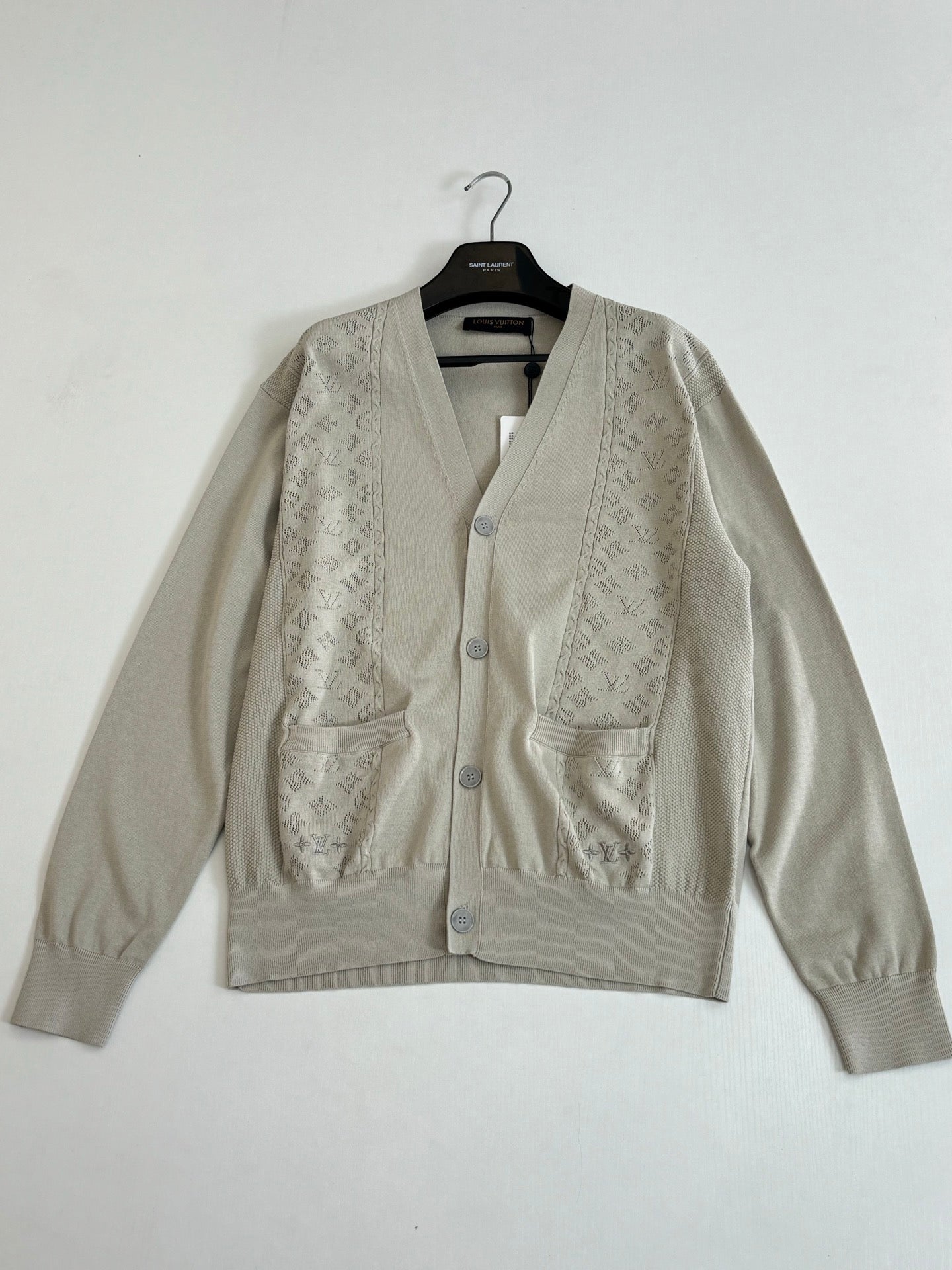 Light cream button-front knit cardigan with V-neck and textured panel detailing