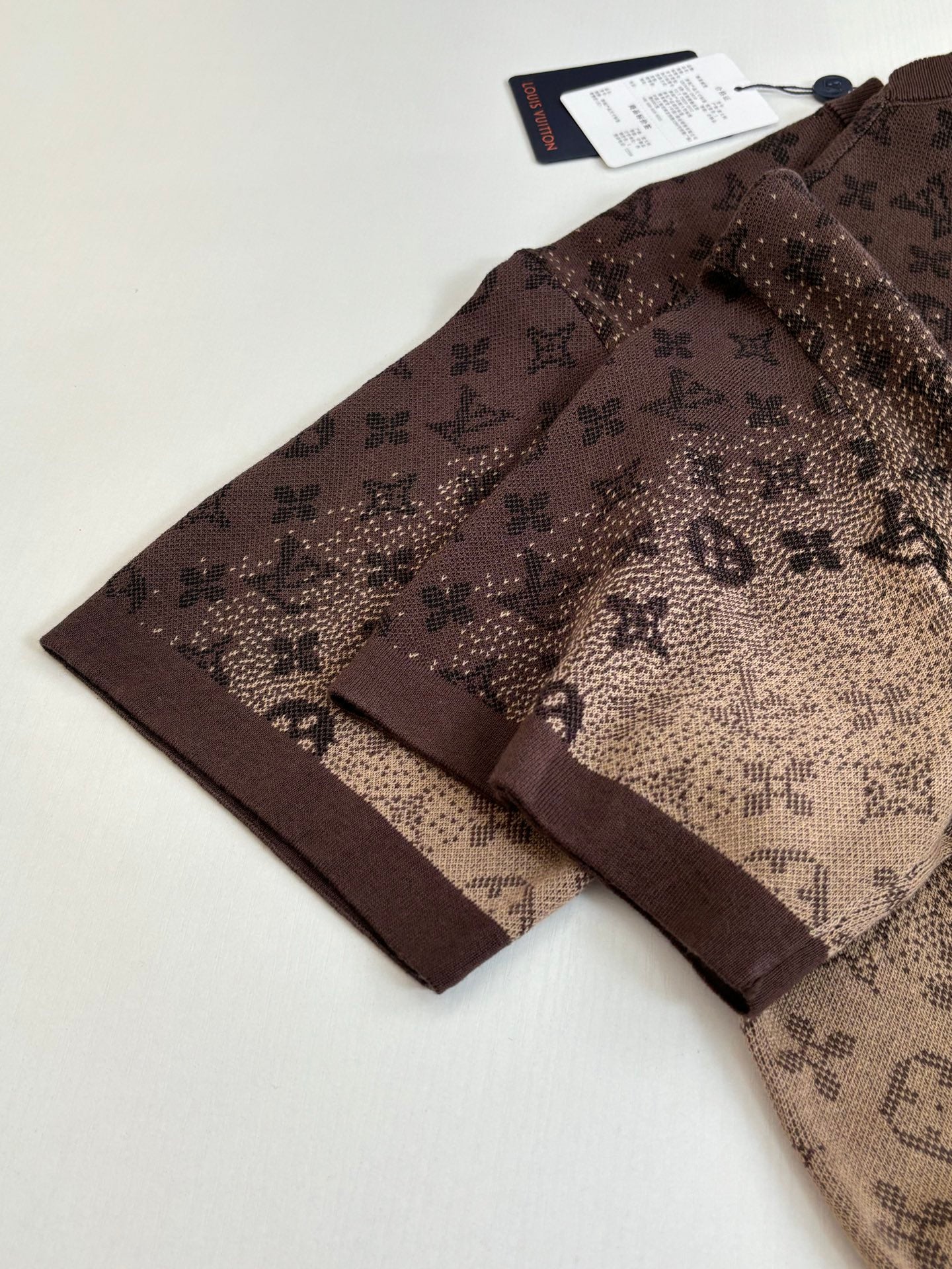 Louis Vuitton monogram short-sleeve shirt laid flat, dark brown