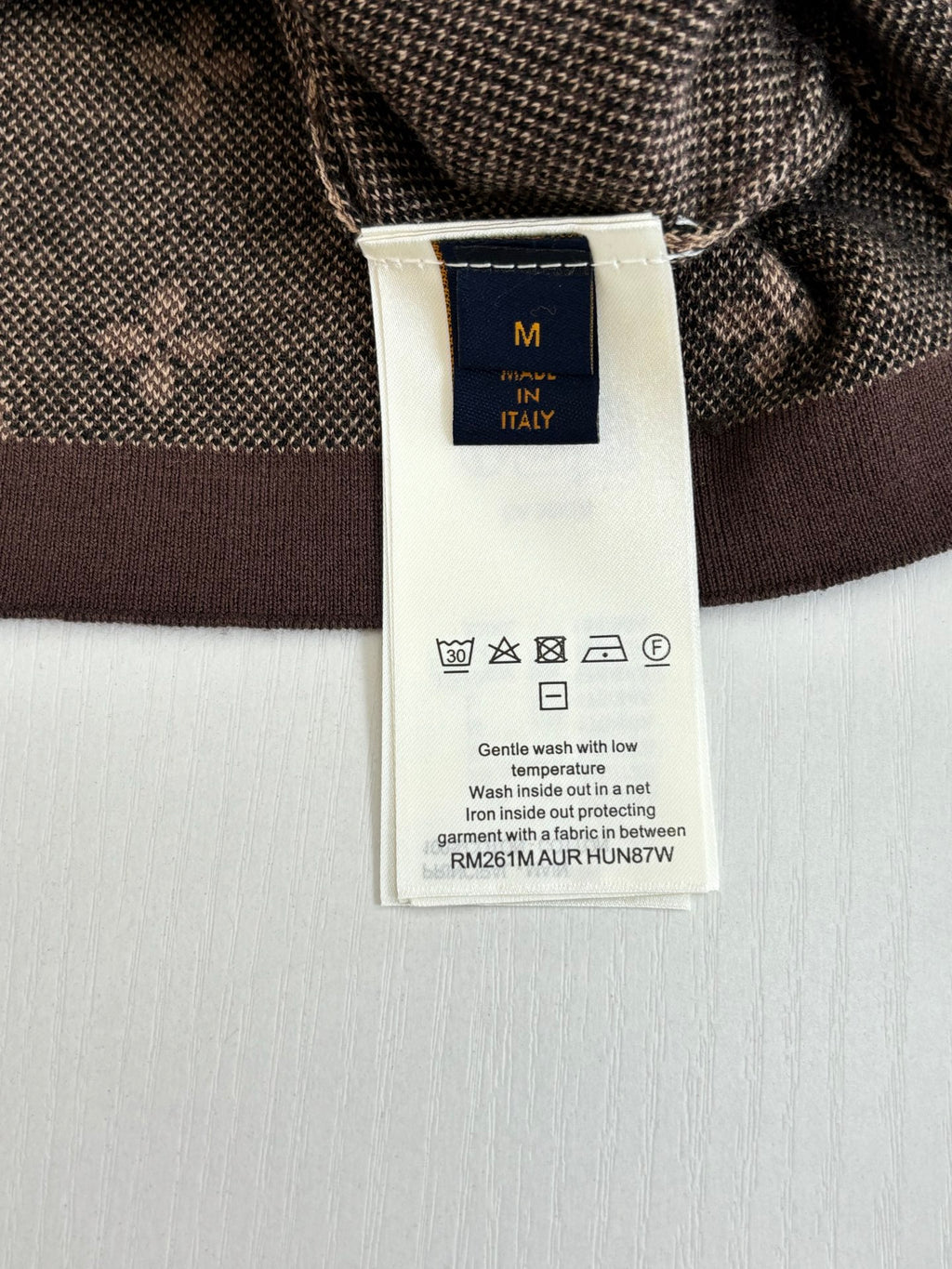 Care label on Louis Vuitton shirt inside collar with size and wash icons