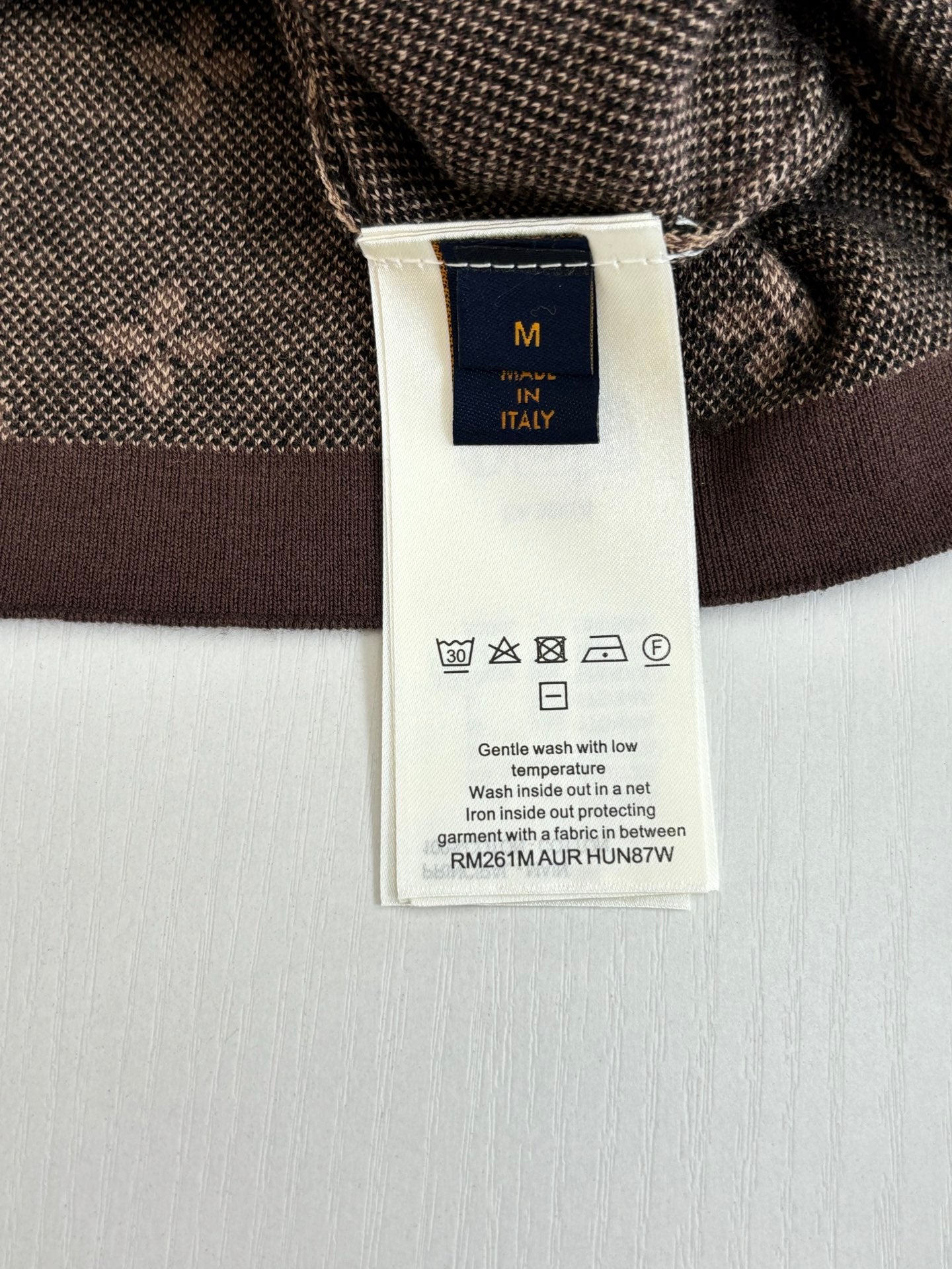 Care label on Louis Vuitton shirt inside collar with size and wash icons
