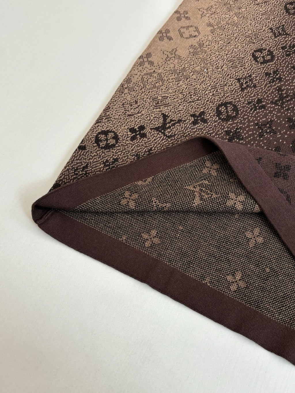 Louis Vuitton monogram shirt hem detail in dark brown