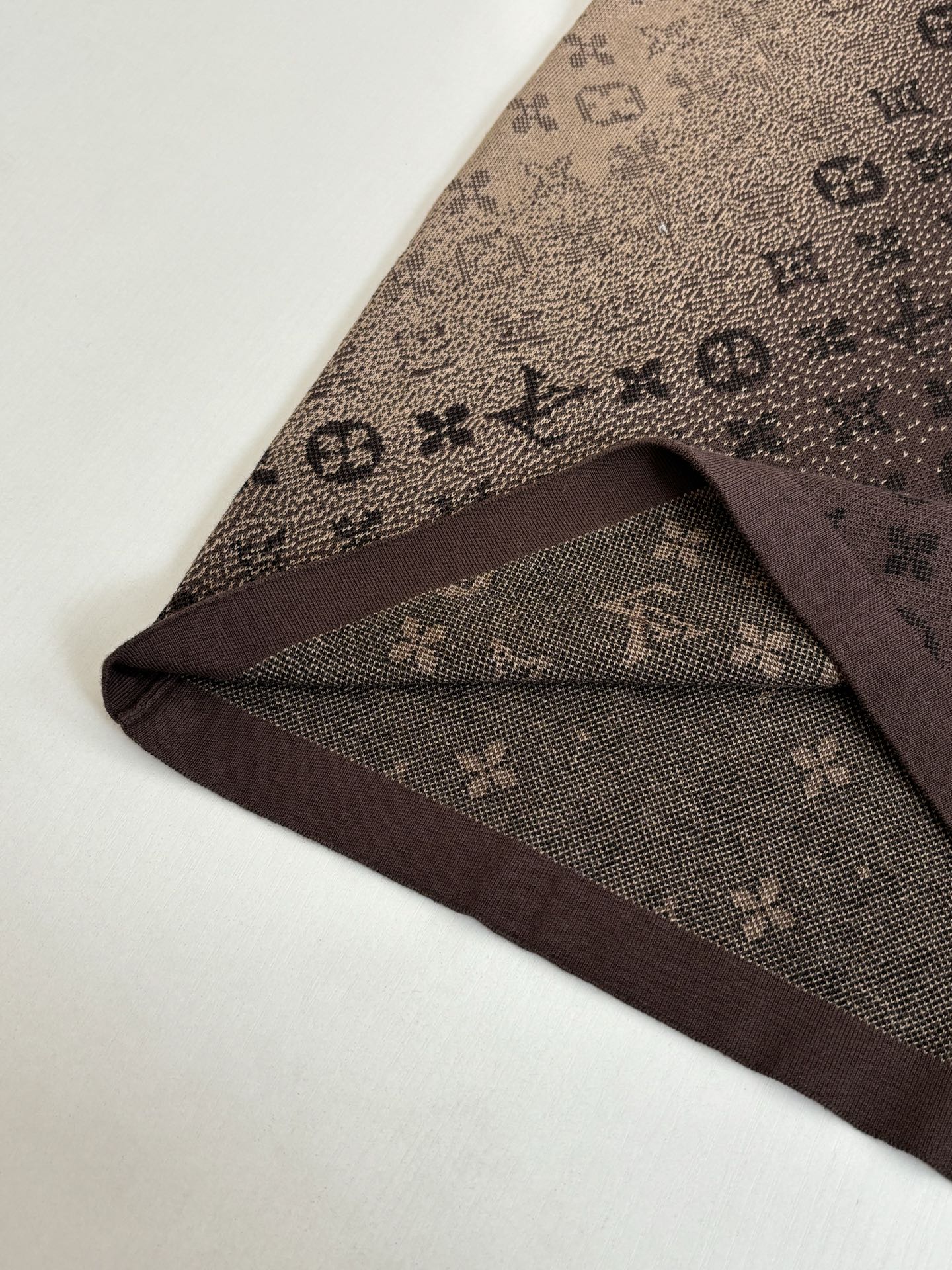 Louis Vuitton monogram shirt hem detail in dark brown