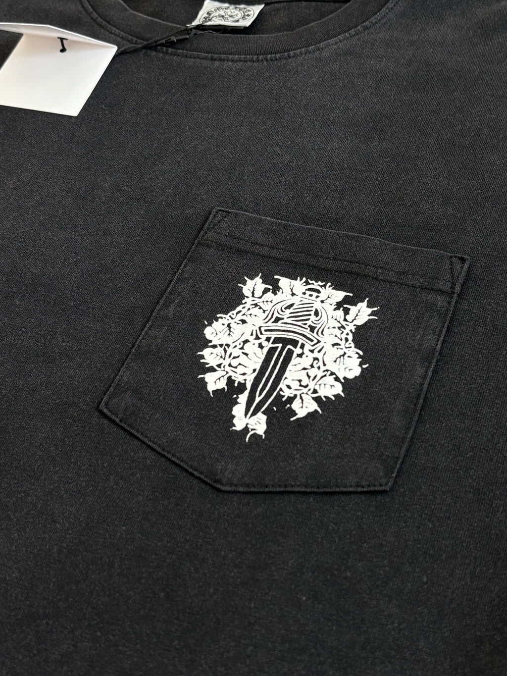 Black long-sleeve sweatshirt with large front patch graphic on pocket area