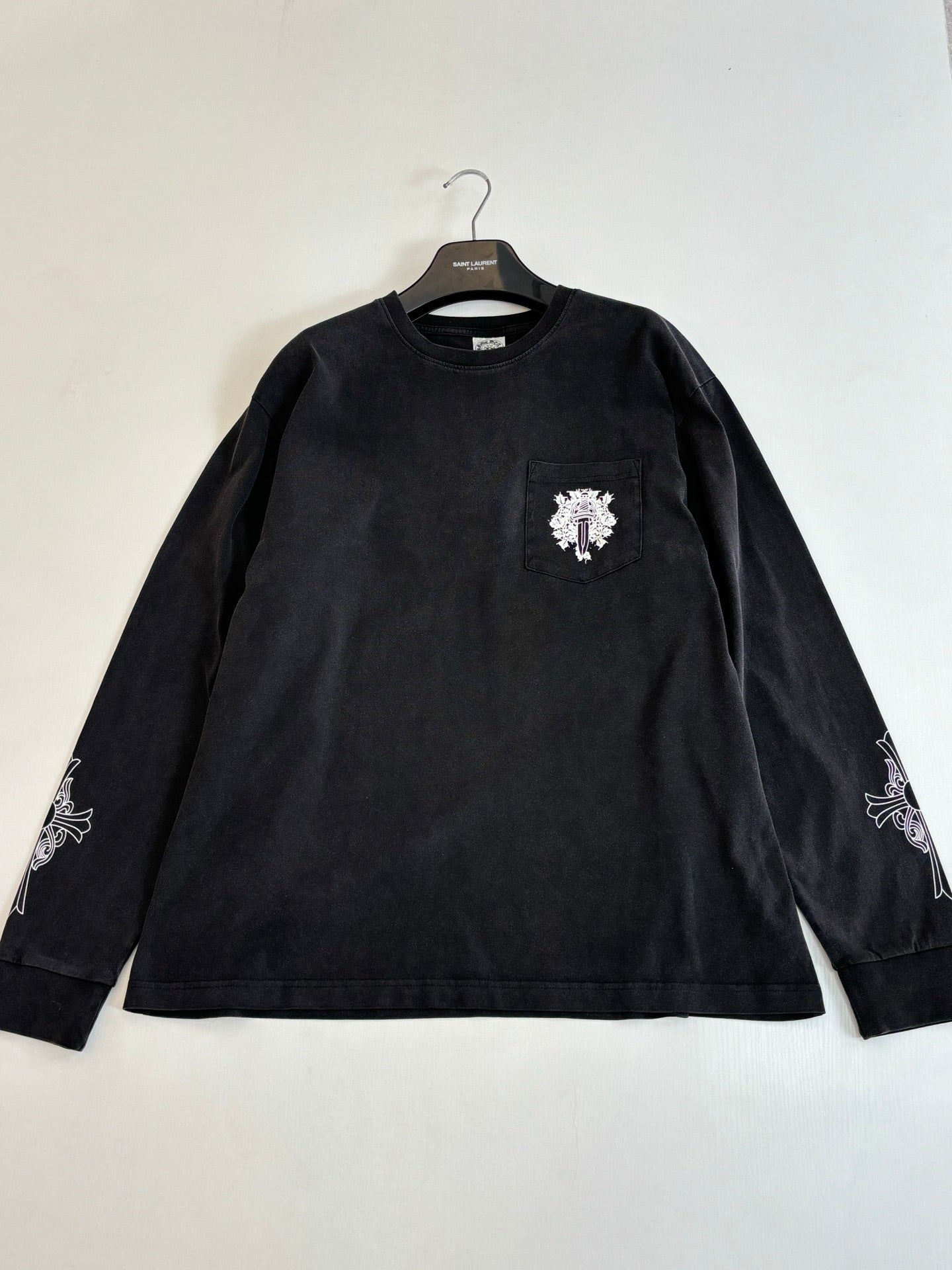 Dark long-sleeve T-shirt with front chest crest patch and embroidered sleeve details