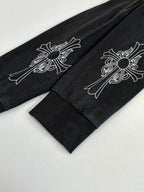 Black long-sleeve sweatshirt sleeves with white floral cross designs