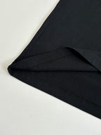 Black short-sleeve T-shirt showing side seam and curved hem