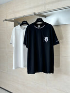 Black and white short-sleeve T-shirts on hangers, each with chest graphic