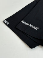 Black T-shirt sleeve cuffs with small white logo prints