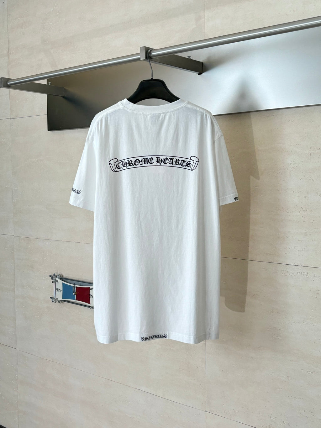 White short-sleeve T-shirt with back center logo print