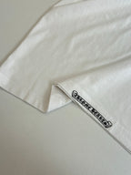 White T-shirt sleeve cuff detail with small logo band