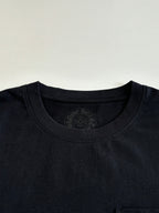 Black T-shirt neckline with circular chest emblem imprint