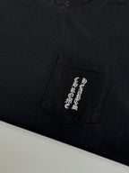 Black T-shirt with rectangular chest pocket graphic patch in light print