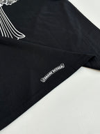 Black T-shirt with small side-hem logo text print