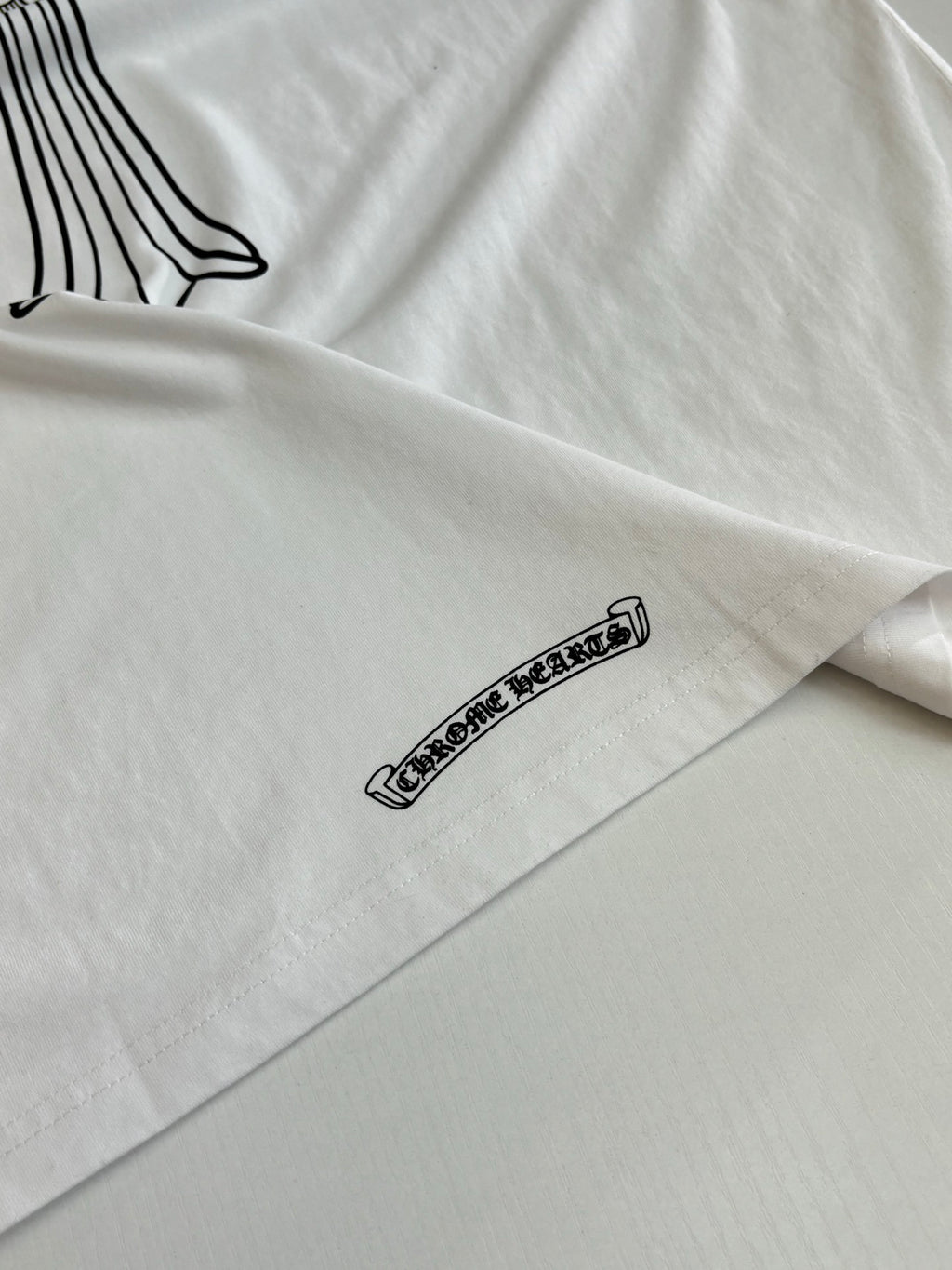 Side seam graphic on white short-sleeve T-shirt
