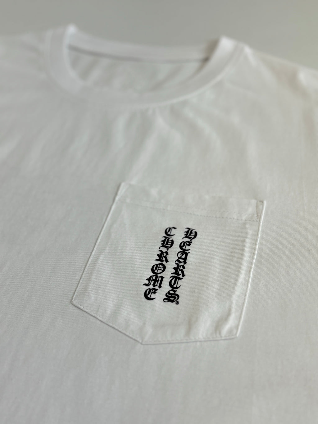 Front chest graphic on white short-sleeve T-shirt