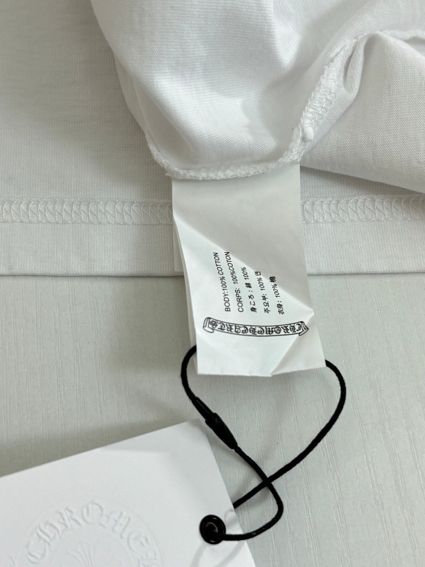 White cloth shorts with waist label and black drawstring