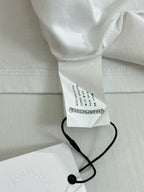 White shorts with care label and black drawstring