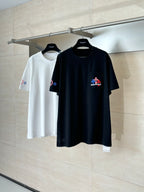 Two short-sleeve T-shirts: black and white, each with multicolor chest logo.