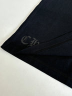 Black T-shirt sleeve with subtle tone-on-tone circular emblem