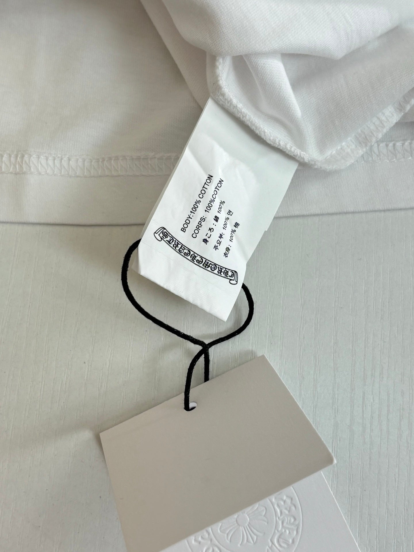 White Chrome shorts with size label and black drawstring